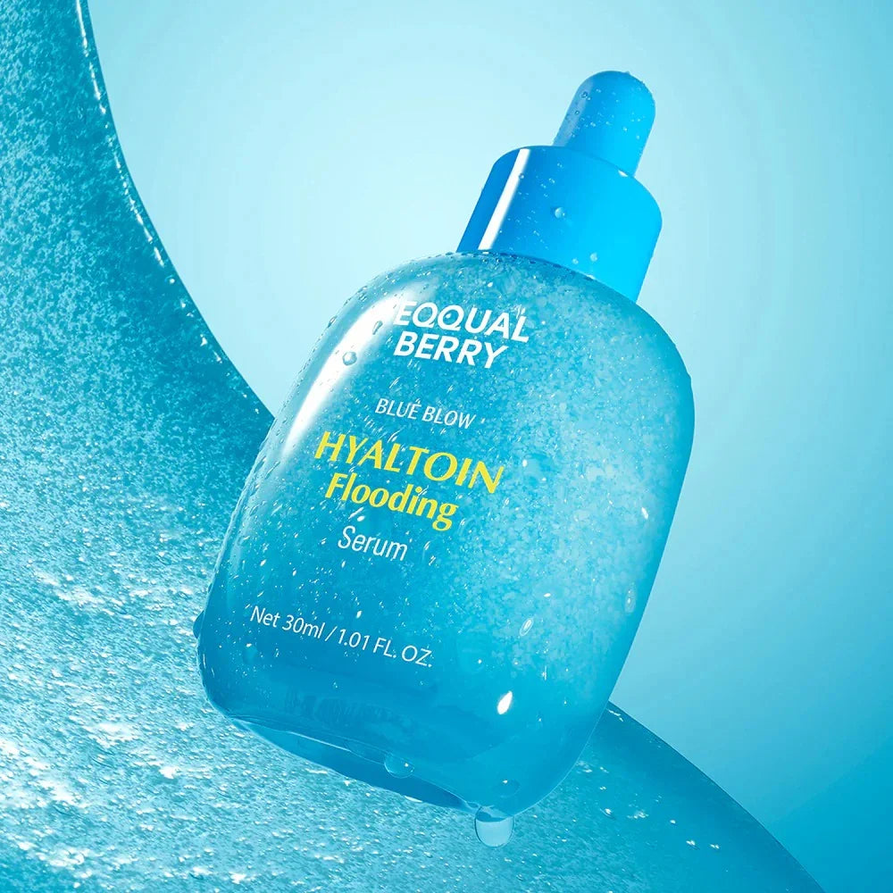 Blue Hyaluronic Acid Serum in transparent bottle with dropper, water droplets, for glowing skin care routine
