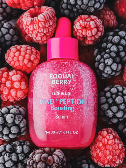 EQQUAL BERRY NAD+ Peptide Boosting Serum in pink bottle with raspberries and blackberries