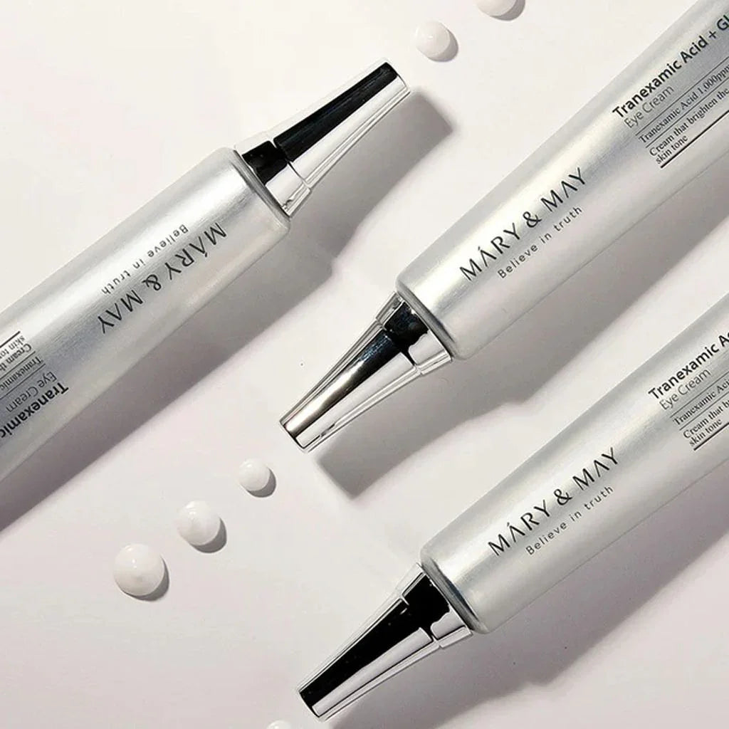 Mary & May Tranexamic Acid Eye Cream tubes with droplets, brightening skincare for glowing skin